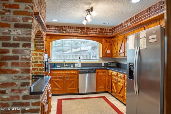 Interior, Kitchen, Recessed Lighting, Stainless Steel Appliances, Stone Walls