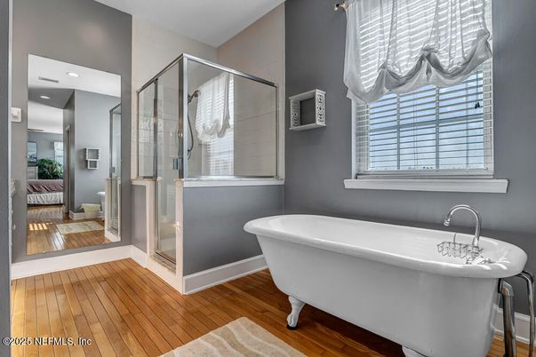 Bathroom, Free Standing Baths, Glass Shower, Interior, Recessed Lighting, Wood Texture Flooring