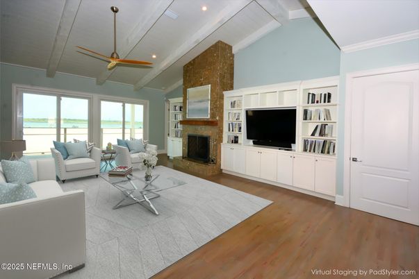 Fireplace, Interior, Living room, Recessed Lighting, Stone Walls, Wood Texture Flooring