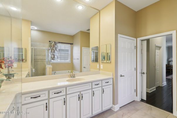 Bathroom, Dual Sink Vanities, Glass Shower, Interior, Recessed Lighting, Wood Texture Flooring