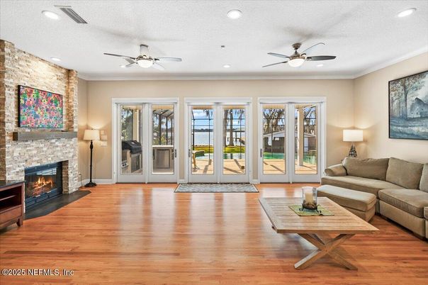 Fireplace, Interior, Living room, Recessed Lighting, Stone Walls, Wood Texture Flooring