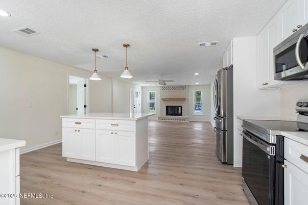 Fireplace, Interior, Kitchen, Pendant Lights, Recessed Lighting, Wood Texture Flooring