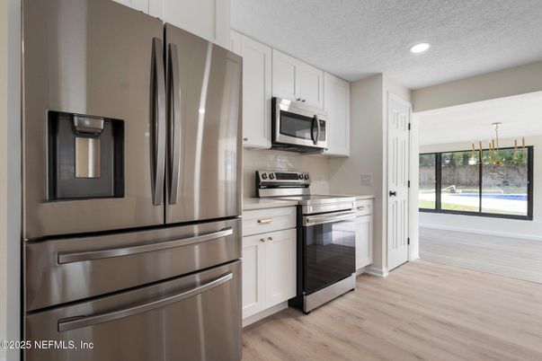 Interior, Kitchen, Recessed Lighting, Stainless Steel Appliances, Wood Texture Flooring