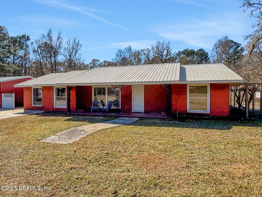 Attached, Backyard, Exterior, Facade, Brick Facade, Ranch