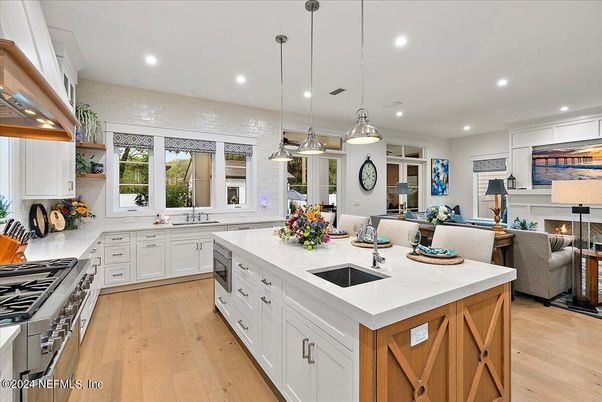 Fireplace, Interior, Kitchen, Living room, Pendant Lights, Recessed Lighting, Stainless Steel Appliances, Wood Texture Flooring