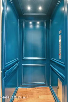 Elevator, Interior, Recessed Lighting, Wood Texture Flooring, Wooden Walls