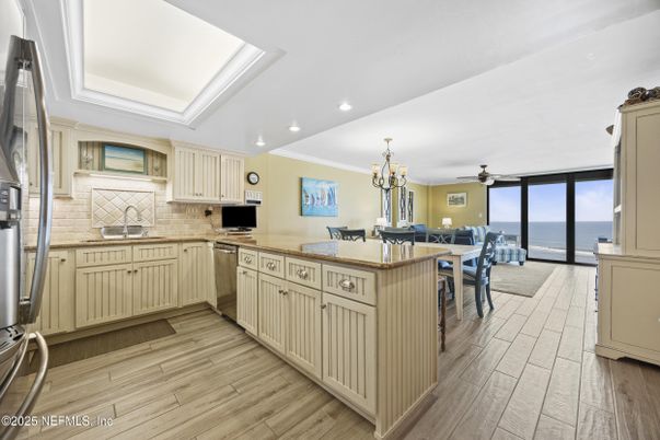 Chandelier, Dining room, Interior, Kitchen, Recessed Lighting, Stainless Steel Appliances, Water, Wood Texture Flooring