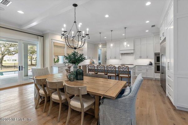 Chandelier, Dining room, Interior, Kitchen, Pendant Lights, Recessed Lighting, Stainless Steel Appliances, Wood Texture Flooring