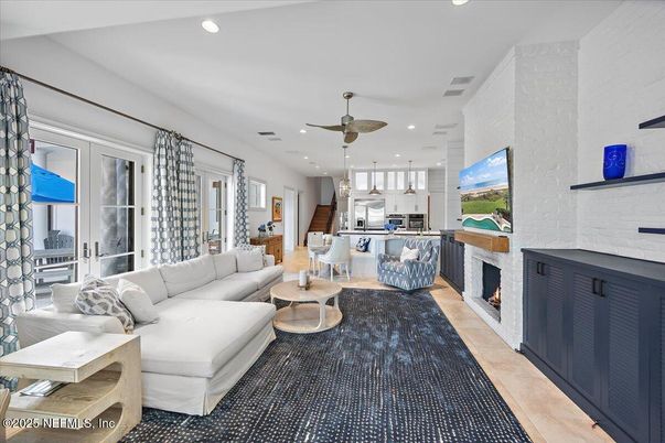 Fireplace, Interior, Kitchen, Living room, Pendant Lights, Recessed Lighting, Stainless Steel Appliances, Stone Walls