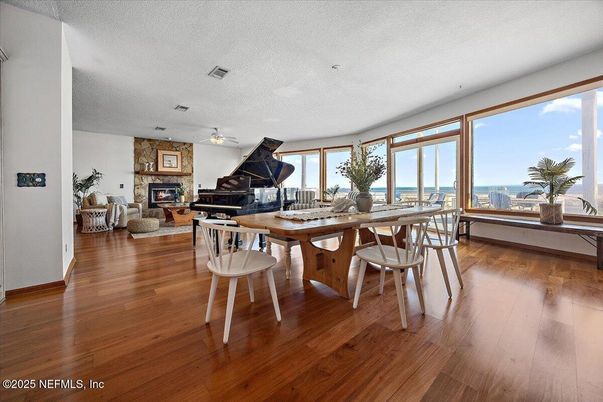 Dining room, Fireplace, Interior, Living room, Piano, Water, Wood Texture Flooring