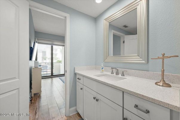Bathroom, Dual Sink Vanities, Interior, Recessed Lighting, Wood Texture Flooring