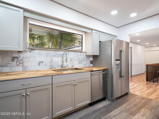 Interior, Kitchen, Marble Walls, Recessed Lighting, Stainless Steel Appliances, Wood Texture Flooring