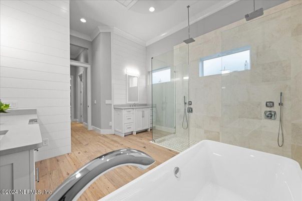 Bathroom, Free Standing Baths, Glass Shower, Interior, Recessed Lighting, Wood Texture Flooring