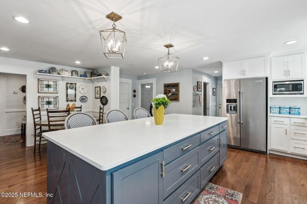 Dining room, Interior, Kitchen, Pendant Lights, Recessed Lighting, Stainless Steel Appliances, Wood Texture Flooring