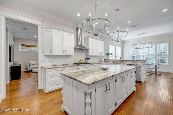 Chandelier, Dining room, Interior, Kitchen, Pendant Lights, Recessed Lighting, Stainless Steel Appliances, Wood Texture Flooring