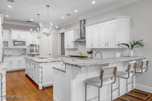 Chandelier, Interior, Kitchen, Pendant Lights, Recessed Lighting, Stainless Steel Appliances, Wood Texture Flooring