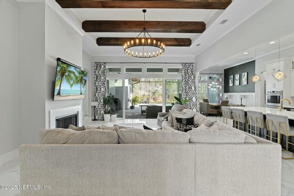 Chandelier, Dining room, Fireplace, Interior, Living room, Marble, Pendant Lights, Recessed Lighting, Wooden Beams