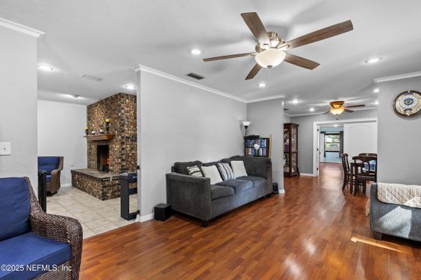Dining room, Fireplace, Interior, Recessed Lighting, Stone Walls, Wood Texture Flooring