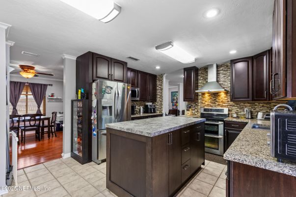 Dining room, Interior, Kitchen, Recessed Lighting, Stainless Steel Appliances, Wood Texture Flooring