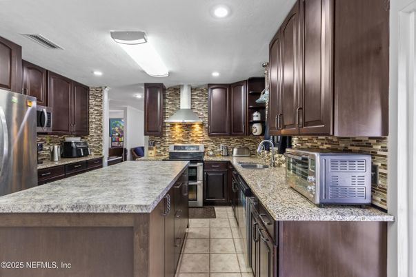 Interior, Kitchen, Recessed Lighting, Stainless Steel Appliances, Stone Walls