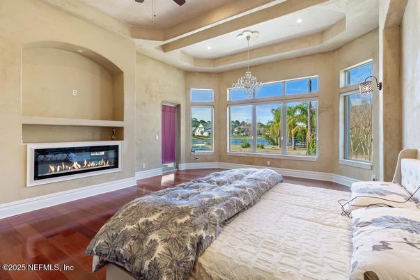Bedroom, Chandelier, Fireplace, Interior, Recessed Lighting, Wood Texture Flooring