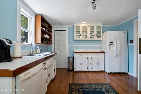 Interior, Kitchen, Recessed Lighting, Tile Countertops, Wood Texture Flooring