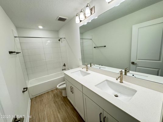 Bathroom, Dual Sink Vanities, Glass Shower, Interior, Recessed Lighting, Wood Texture Flooring