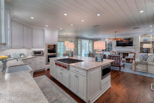 Dining room, Fireplace, Interior, Kitchen, Living room, Pendant Lights, Recessed Lighting, Stainless Steel Appliances, Wood Texture Flooring