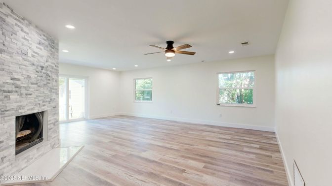 Empty room, Fireplace, Interior, Recessed Lighting, Stone Walls, Wood Texture Flooring