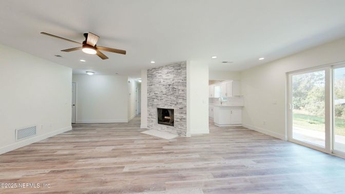 Empty room, Fireplace, Interior, Recessed Lighting, Stone Walls, Wood Texture Flooring