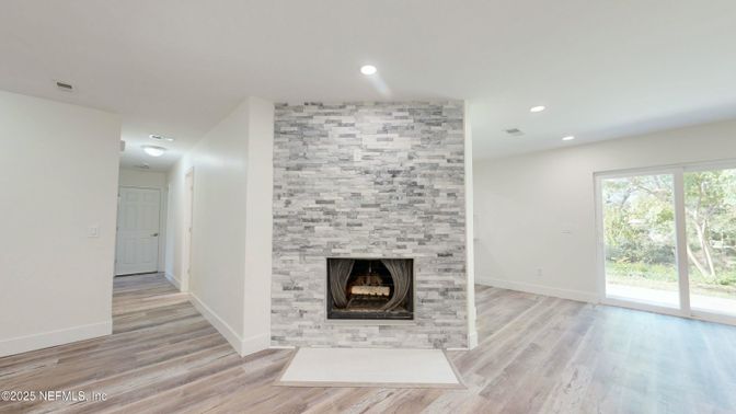 Empty room, Fireplace, Interior, Recessed Lighting, Stone Walls, Wood Texture Flooring