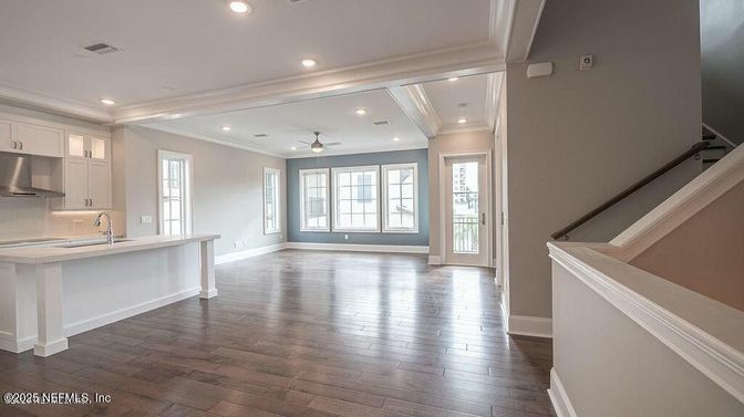 Empty room, Interior, Kitchen, Recessed Lighting, Stainless Steel Appliances, Wood Texture Flooring