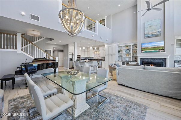 Chandelier, Dining room, Fireplace, Interior, Kitchen, Living room, Pendant Lights, Piano, Recessed Lighting, Wood Texture Flooring