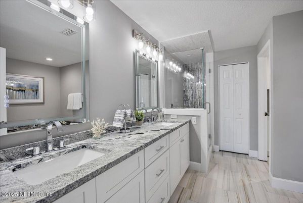 Bathroom, Dual Sink Vanities, Glass Shower, Interior, Recessed Lighting, Wood Texture Flooring