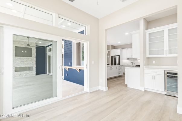 Fireplace, Interior, Kitchen, Recessed Lighting, Stainless Steel Appliances, Wood Texture Flooring