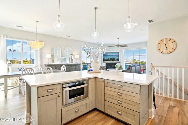 Chandelier, Dining room, Interior, Kitchen, Pendant Lights, Stainless Steel Appliances, Water, Wood Texture Flooring
