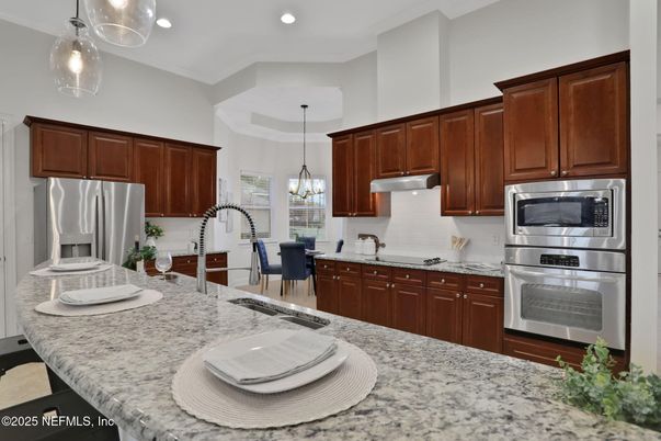 Chandelier, Dining room, Interior, Kitchen, Pendant Lights, Recessed Lighting, Stainless Steel Appliances