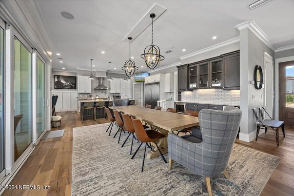 Chandelier, Dining room, Interior, Kitchen, Pendant Lights, Recessed Lighting, Stainless Steel Appliances, Wood Texture Flooring