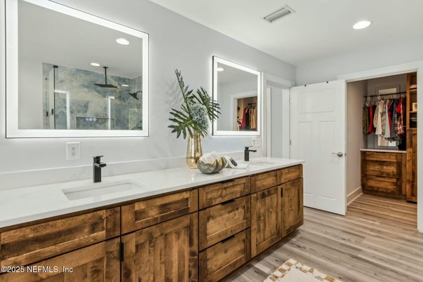 Bathroom, Dual Sink Vanities, Interior, Recessed Lighting, Walk-in Closets, Wood Texture Flooring