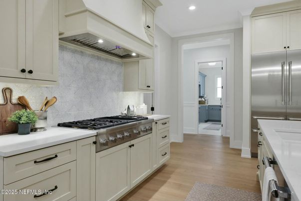 Interior, Kitchen, Recessed Lighting, Stainless Steel Appliances, Washer, Wood Texture Flooring