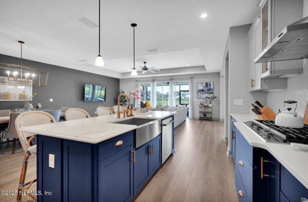 Dining room, Interior, Kitchen, Pendant Lights, Recessed Lighting, Stainless Steel Appliances, Wood Texture Flooring