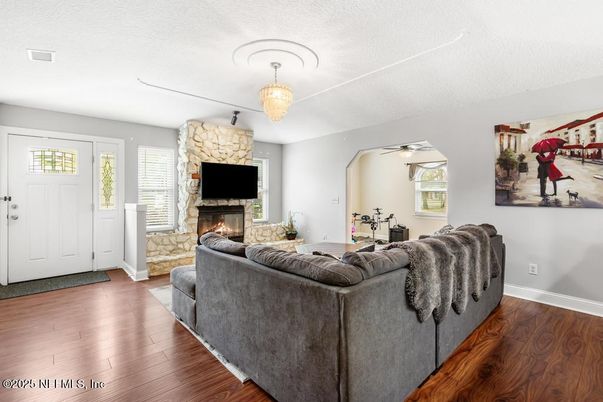 Chandelier, Fireplace, Interior, Living room, Stone Walls, Wood Texture Flooring