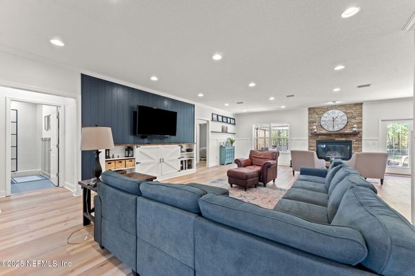 Fireplace, Interior, Living room, Recessed Lighting, Stone Walls, Wood Texture Flooring