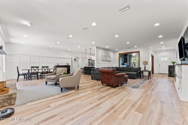 Dining room, Fireplace, Interior, Living room, Pendant Lights, Recessed Lighting, Wood Texture Flooring