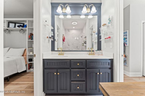 Bathroom, Dual Sink Vanities, Interior, Marble Walls, Wood Texture Flooring