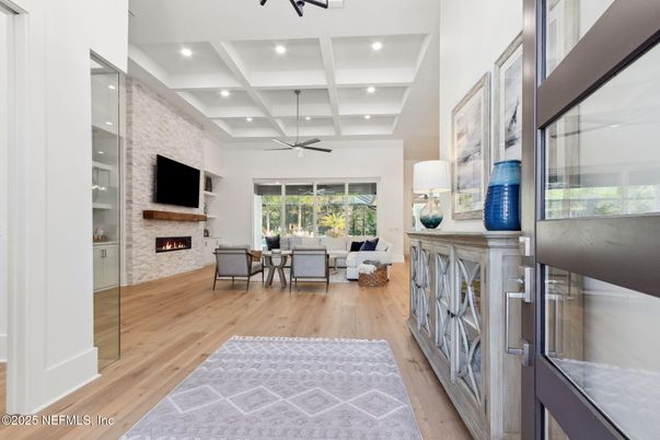 Fireplace, Interior, Living room, Recessed Lighting, Stone Walls, Wood Texture Flooring