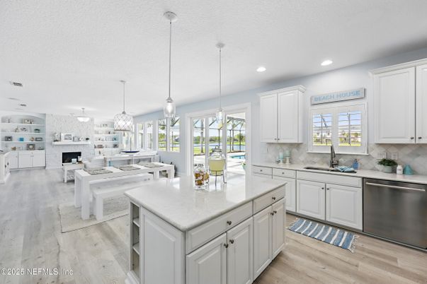 Dining room, Fireplace, Interior, Kitchen, Living room, Pendant Lights, Recessed Lighting, Stainless Steel Appliances, Wood Texture Flooring