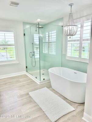 Bathroom, Chandelier, Free Standing Baths, Glass Shower, Interior, Recessed Lighting, Wood Texture Flooring