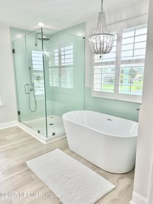 Bathroom, Free Standing Baths, Glass Shower, Interior, Pendant Lights, Recessed Lighting, Wood Texture Flooring