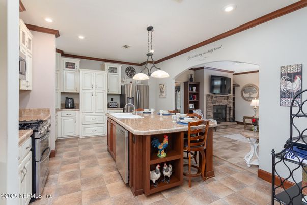 Fireplace, Interior, Kitchen, Pendant Lights, Recessed Lighting, Stainless Steel Appliances